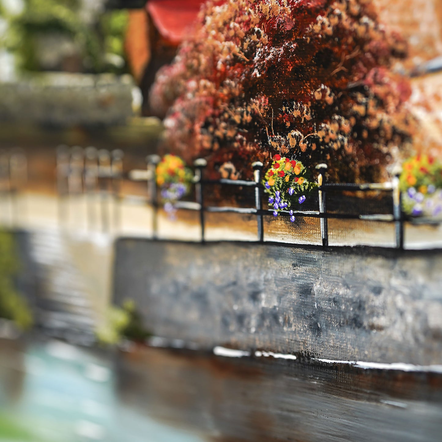 Painting of a flower basket above a river on a painting
