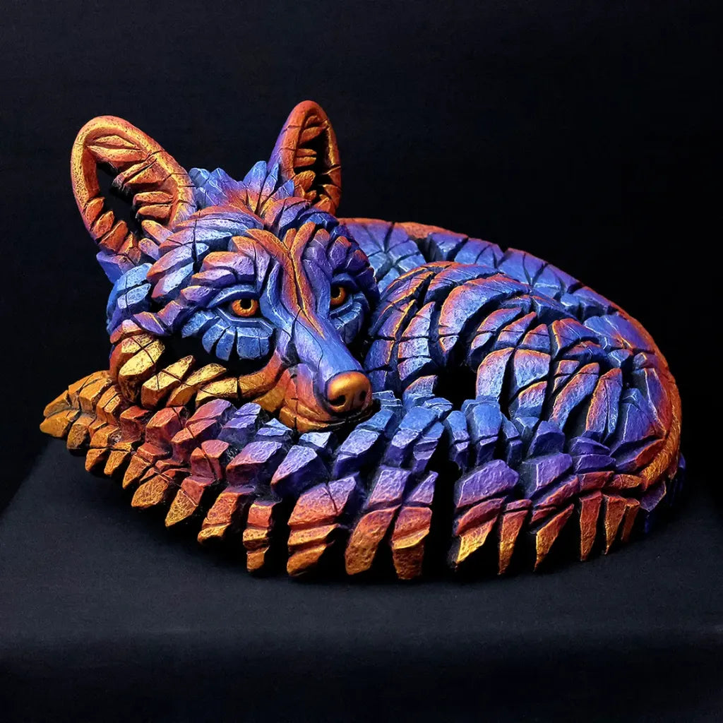 Colorful wolf sculpture on a black background