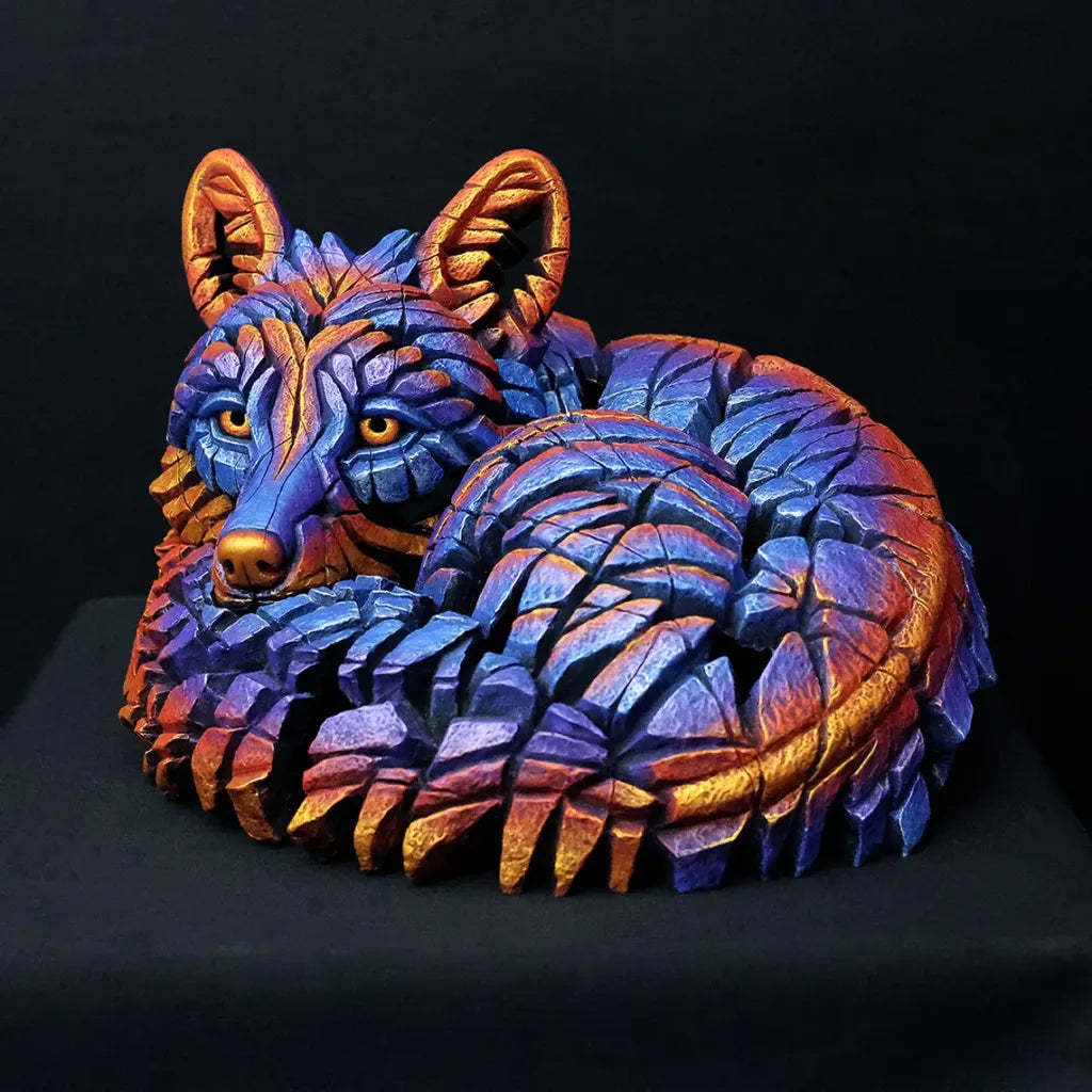 Colorful wolf sculpture on a black background