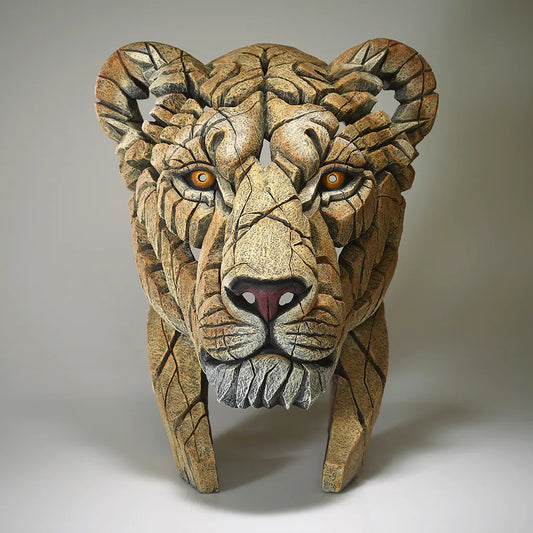 Sculpture of a Lions Head on a grey background