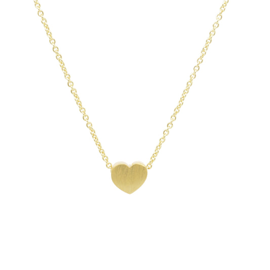 Gold heart-shaped pendant on a gold chain against a white background