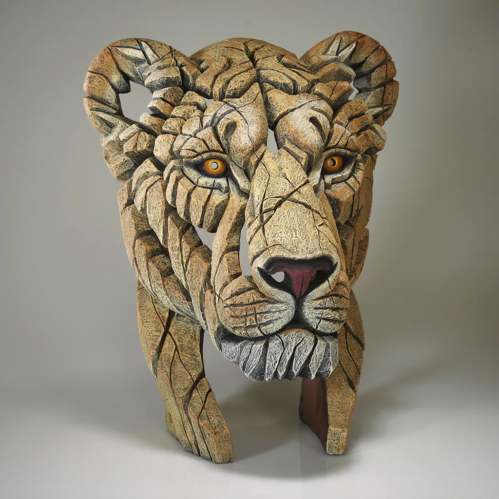 Sculpture of a Lions Head on a grey background