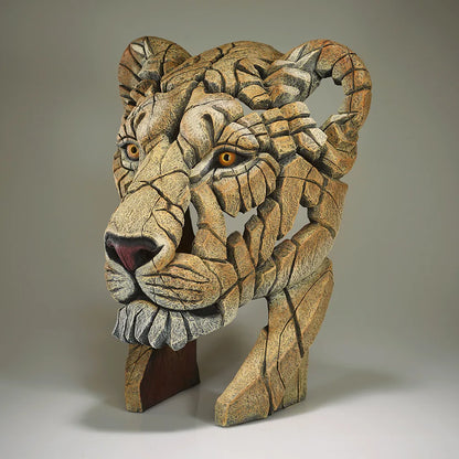Sculpture of a Lions Head on a grey background