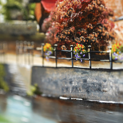 Painting of a flower basket above a river on a painting