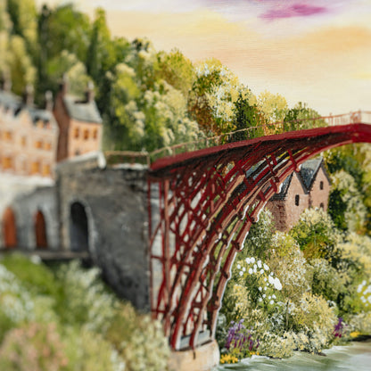 Painting of a red bridge over a river with houses and trees in the background
