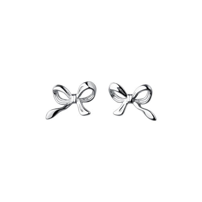Silver bow-shaped earrings on a white background