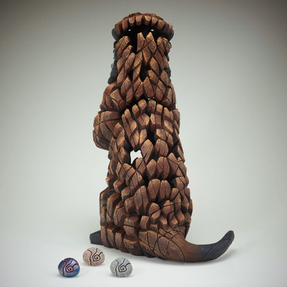 Otter Sculpture from Edge Sculpture by Matt Buckley holding different colour pebbles.
