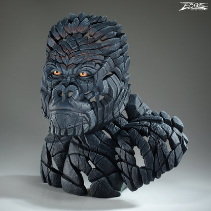 Statue of a gorilla with detailed texture on a gray background