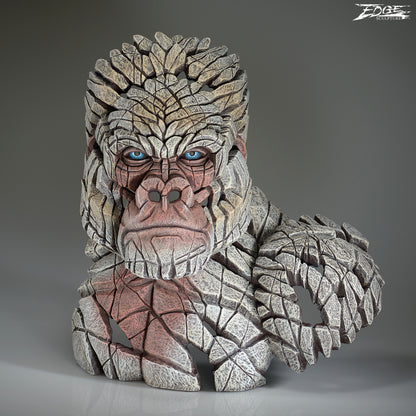 Stone-like creature head with detailed texture on a gray background