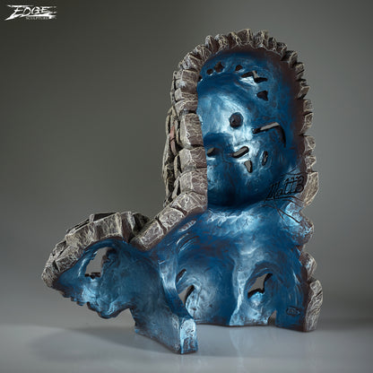 Blue and gray sculpture with abstract design on a gray background