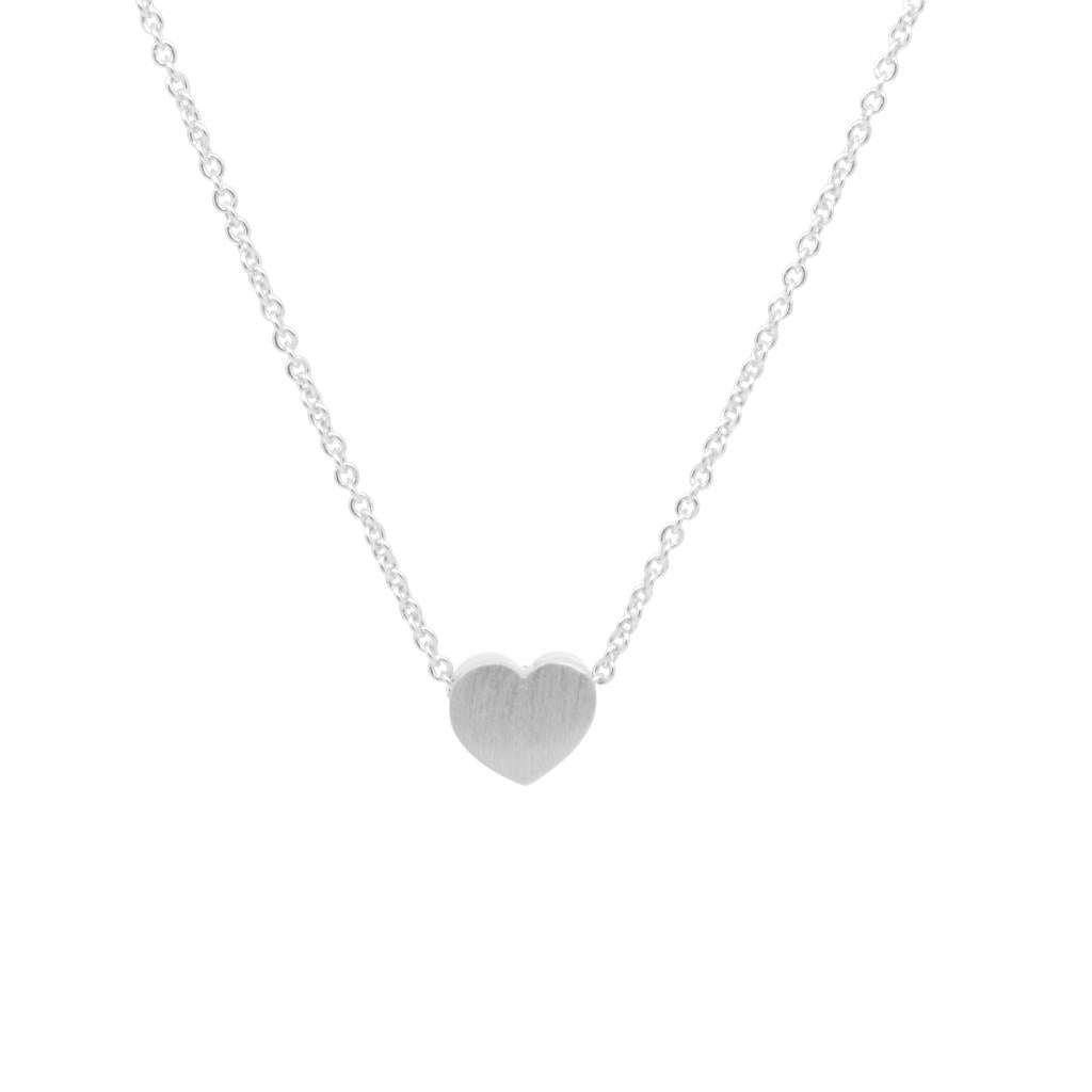 Silver heart-shaped pendant on a chain against a white background