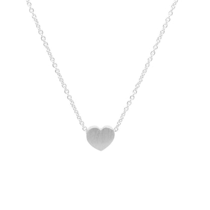 Silver heart-shaped pendant on a chain against a white background