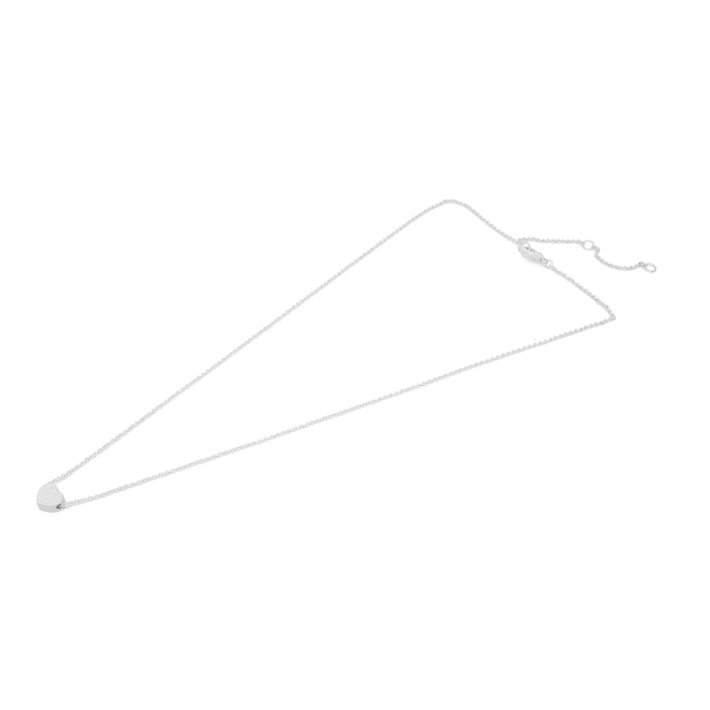 Silver necklace chain on a white background. Heart shape necklace.