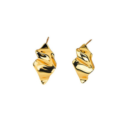 Pair of gold earrings on a white background