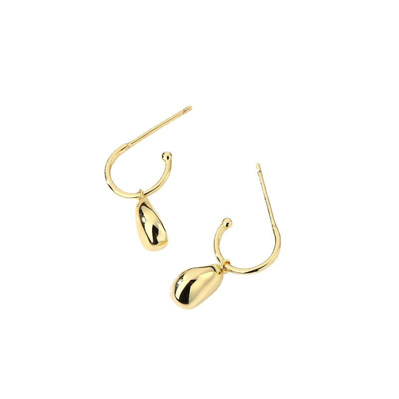 Gold earrings on a white background