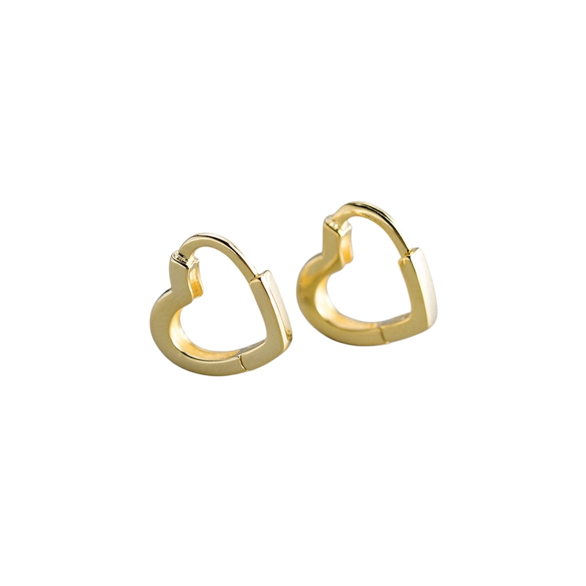 Gold heart-shaped hoop earrings on a white background